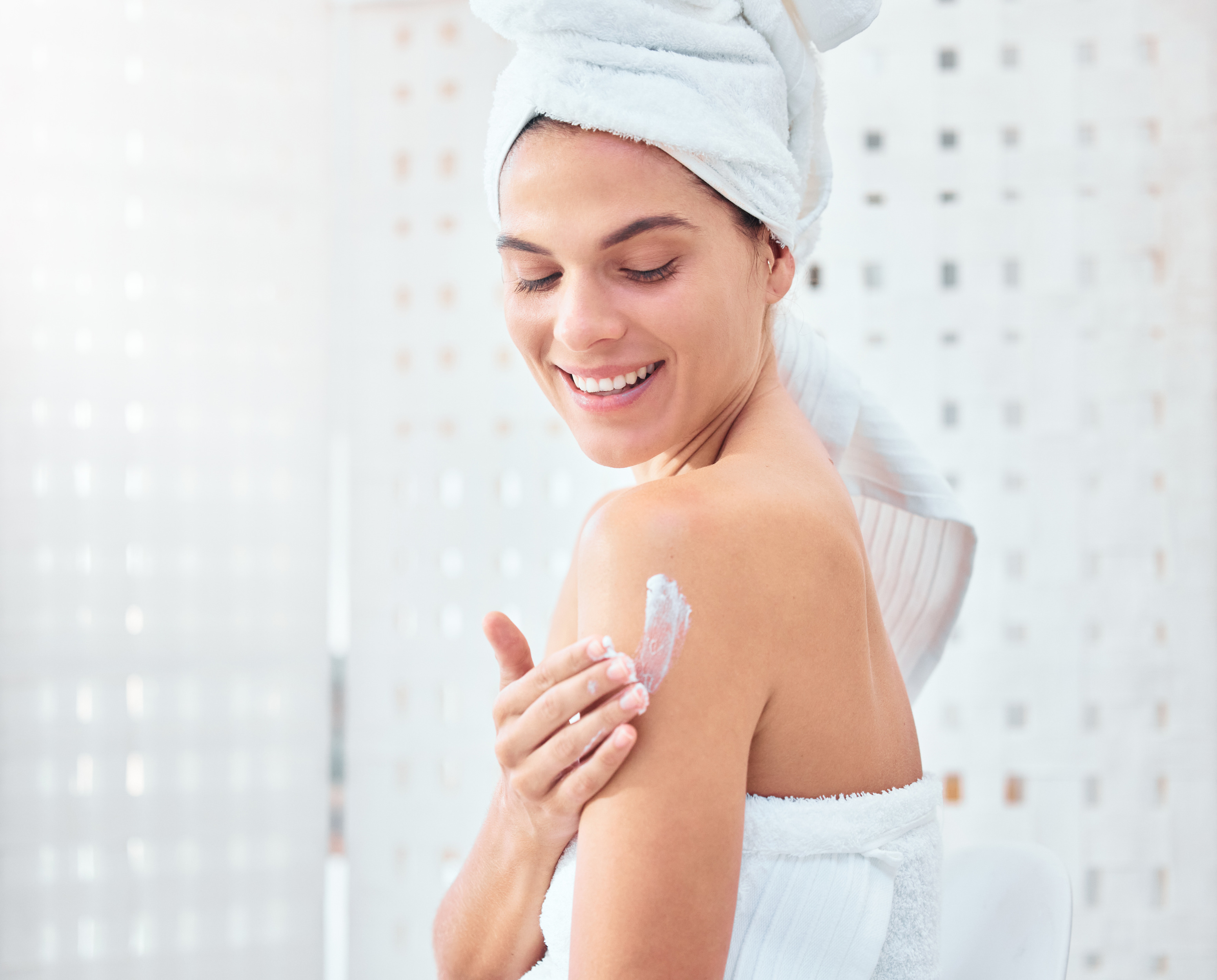 woman applying product on her body