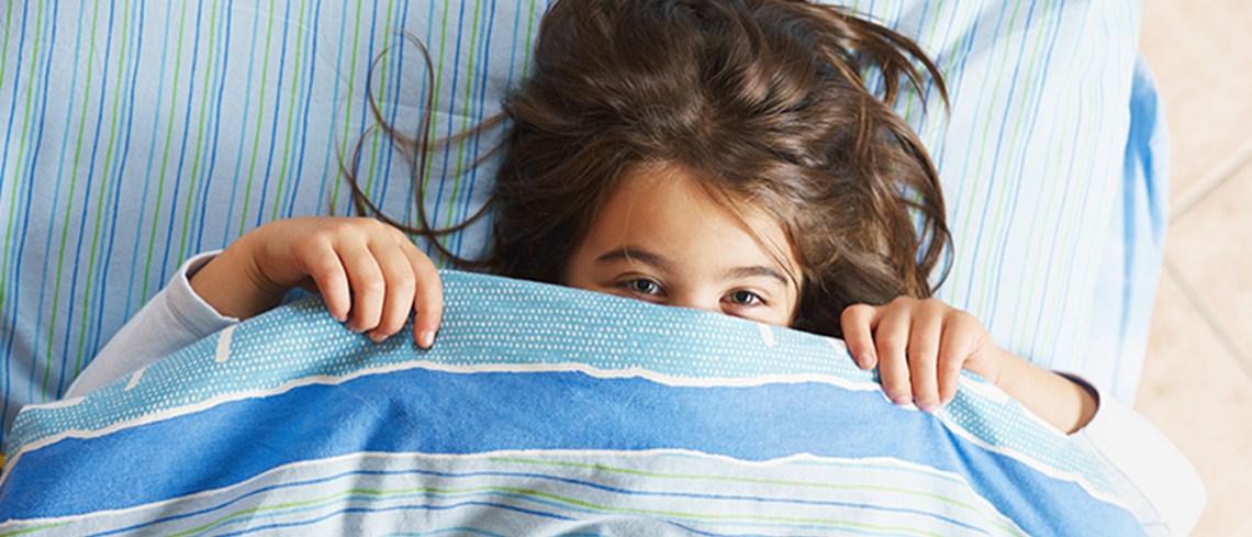 Girl Hides under the Blanket