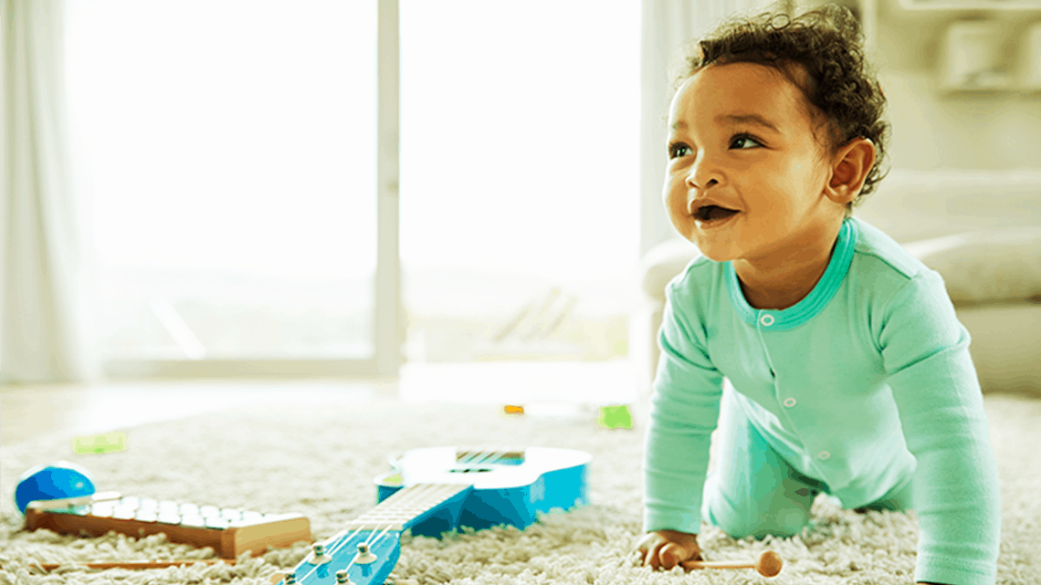 A Baby Plays on the Carpet